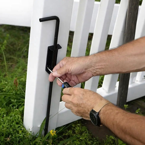 Using a screwdriver on a Heavy Duty 24 Inch Gate Drop Rod And Cane Bolt Forged From Beefy Half Inch Solid Steel.