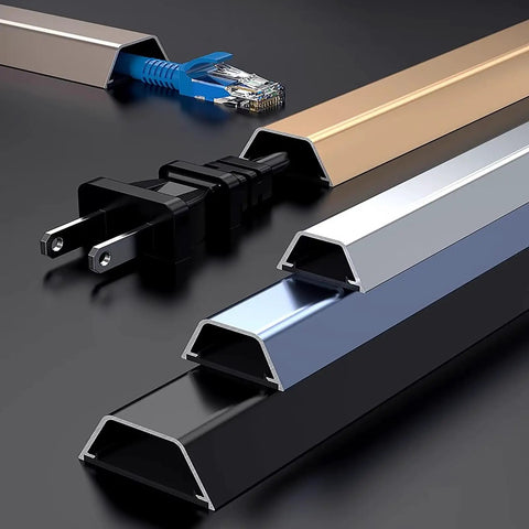 Wall Mounted Cable Raceway For Hidden Wires And Waterproof Cord Cover Keeps Cables Neat And Safe Baby Proof Ready For Home And Office 1 Meter Long By 30mm Wide Durable Wire Management Solution, close-up view with cords inside aluminium raceways of different colors.
