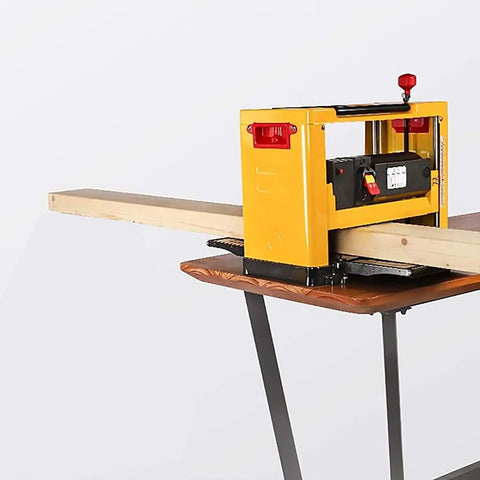 Rock Solid Bench Top Thickness Planer Delivering Beasty 2000W Power For Killer Smooth Cuts And Fast Wood Stock Reduction on a table, with a wooden board feeding through.