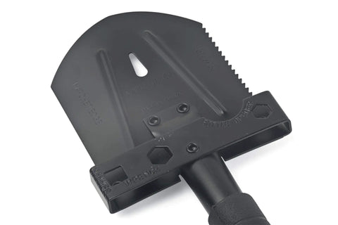 Close-up of the Grab-N-Go 12-In-1 Survival Multi-Tool Shovel head showing axe hatchet saw hammer wrench and bottle opener.