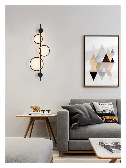 Top Shelf Modern Wall Sconce With Straight Fire Led Glow And Hella Sturdy Iron Frame illuminating a cozy living room setting.