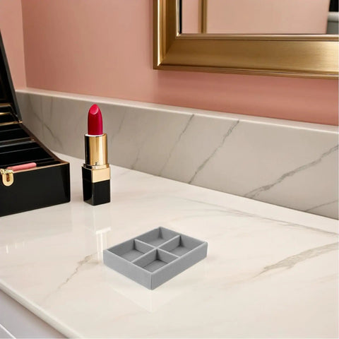 Prime Velvet Jewelry Organizer Tray With Four Grid Sections Stackable Display Holder For Watches Bracelets Rings on marble surface.