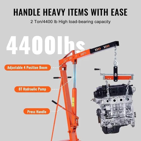 Heavy Duty Hydraulic Engine Hoist 2 Ton Folding Cherry Picker Shop Crane With Precision Leveler 4400 Lbs Capacity lifting an engine