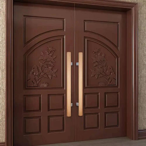 Double sided push pull door handle on ornately carved brown doors, featuring genuine beech wood and stainless steel connector.