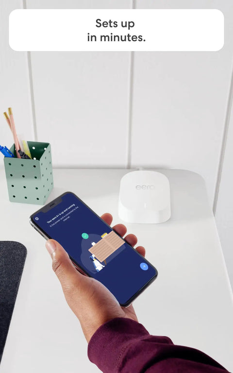 Person setting up Budget Friendly Mesh WiFi System With Gigabit Speeds And WiFi 6 Plus Coverage Up To 4,500 Sq Ft Connect 75+ Devices