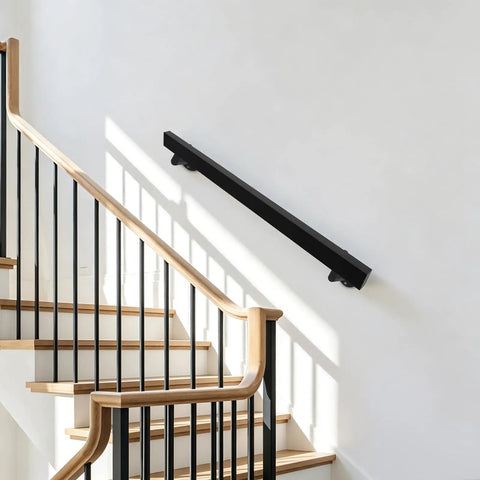 Rock Solid Four Foot Flush Handrail Wall Mount Stair Railing With Sleek Matte Black Finish And Heavy Duty Stainless Steel Design installed on staircase.