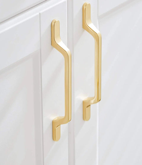 Top Shelf Heavy Gauge Zinc Alloy Cabinet Pulls Bow Handles Set Of Two Swanky Premium Electroplated Gold on white cabinet doors.