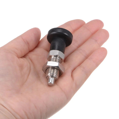 Top Shelf Stainless Steel Ball Nose Spring Plunger Set With Push Fit Design And M12x1.5 Thread Holding A Solid 6mm Pin in hand.