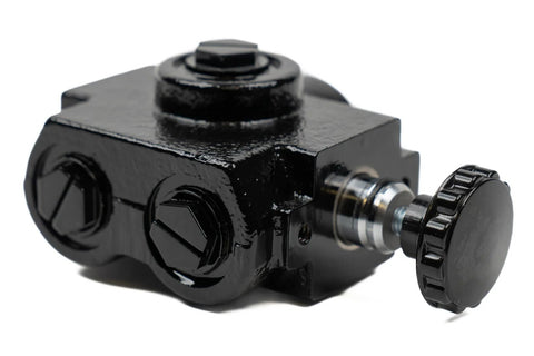 Close-up of a heavy-duty hydraulic selector valve for industrial systems.