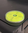 3.15 Inch Magnetic Bullseye Bubble Level Featuring Rock Solid Rear Magnet For RV And Heavy Machinery Workshop Must Have Tool on a black surface.
