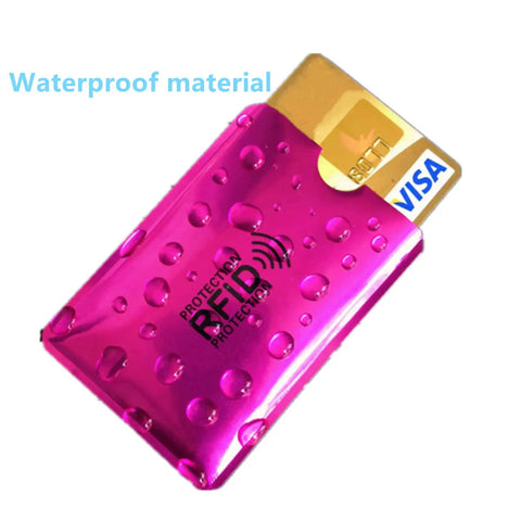 16 Piece RFID Blocking Sleeve Set With 12 Colorful Credit Card Protectors And 4 Passport Holders, Waterproof Aluminum Foil Wallet Shield To Stop Skimming And Electronic Theft On The Go, shown with purple sleeve