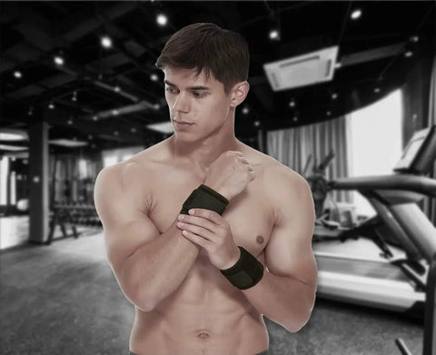Man wearing 2 Pack Adjustable Wrist Brace Set for Fitness and Weightlifting, Keeps Tendonitis and Carpal Tunnel in Check, at gym