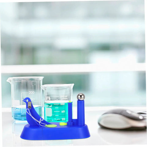 Sky-blue brass pendulum kit for classroom science, shown near beakers, a hands-on physics lab tool in middle school setup.