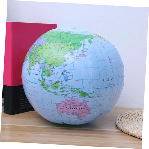 Inflatable World Globe Beach Ball For Kids Learn Geography With Detailed Continents, Countries, Capitals And Oceans on a table