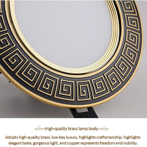 Top Shelf 9 Piece LED Recessed Downlights Featuring Round Brass Baffle Trims And Solid Copper Panels with a close-up view of brass trim design.