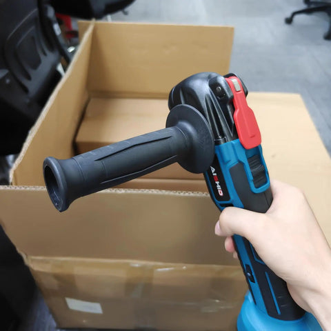 Cordless Battery Angle Grinder With Variable Speed And Low Vibration Ergonomic Handle held in hand for easy paint scraping.