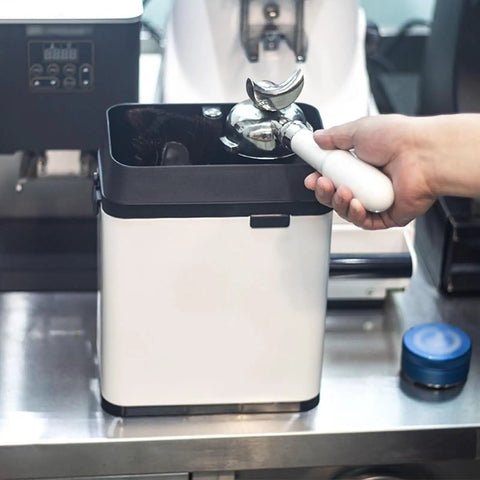 Kick Up Your Daily Brew Routine With This Badass 150 Watt Electric Portafilter Cleaner And Espresso Knock Box Combo For Effortless Home Barista Cleanup, showing portafilter in knock box.