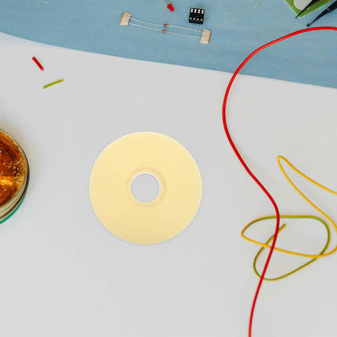 Assorted electronic components including resistors and wires on a table.