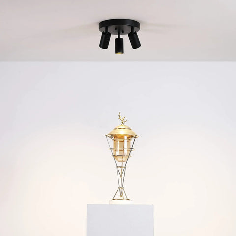 Shura Round 3-Light Integrated LED Ceiling Fixture With Rotatable Heads White Flush Mount 3000K 1365 Lumens above golden sculpture