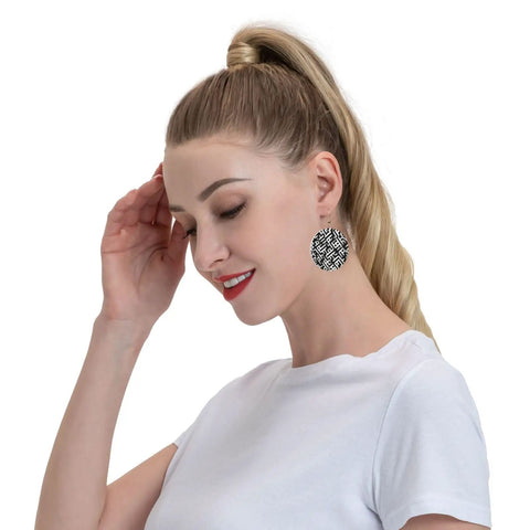 Black And White Grid Print Dangle Earrings For Women, Hella Lightweight Faux PVC Leather Look With Secure Silver Plated Hooks on model.