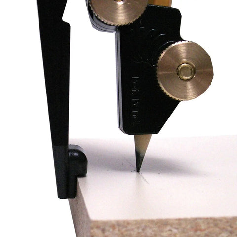 Close-up of the Accuscribe Pro Scribing Tool marking a precise line on a countertop, showing easy grip and consistent scribe offset.
