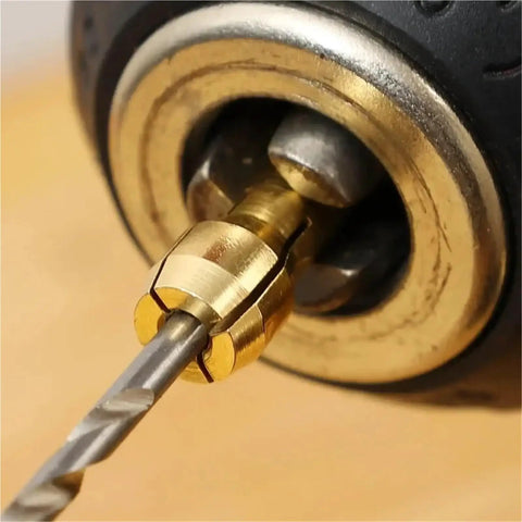 Close-up of 10 Pack Mini Drill Brass Collet Chuck 0.5 To 3.2mm clamping adapter securing a drill bit, highlighting its solid brass material.