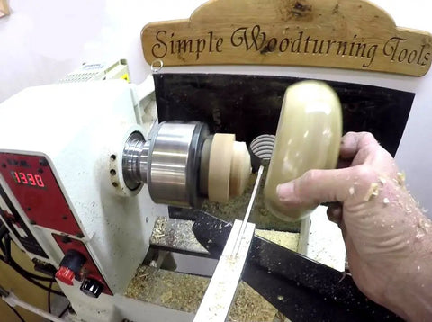 Premium Brazed Carbide Parting And Grooving Tool For Wood Turning Lathe in use on a wood lathe with aluminum handle.