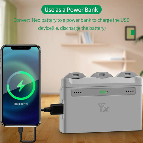 Two Way Battery Charging Hub for Neo Drone with phone charging via USB, 3 channel station showing power bank feature in living room
