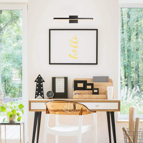 Modern home office with Edinburgh 2 Light LED Integrated Dimmable Wall Sconce Vanity Light above art, showing sleek design and natural light.