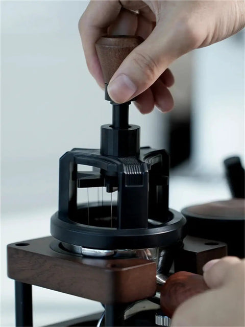 Premium Game Changer 58Mm Espresso Coffee Distributor With Magnetic Base And Precision Rotary Needles being operated to level coffee grounds.