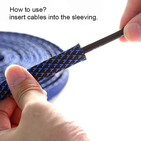 Hands inserting cable into black PET expandable one half inch cable management sleeve protector in close-up view.