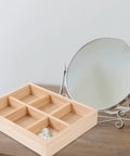 Slick Pine Wood Jewelry Organizer Tray With Six Compartments displaying pearls, ideal for vanity or desk storage.