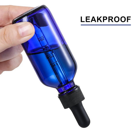 Dead Simple 2 Oz Dark Blue Glass Dropper Bottles, 4 Pack With Exact 1Ml Calibrated Eyedroppers held in hand, leakproof design.