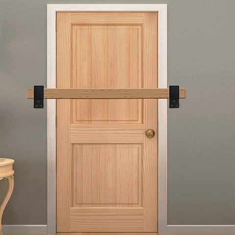 Heavy Duty 2x4 Door Barricade Brackets Built Tough From Solid One Eighth Inch Steel With Anti Rust Coating installed on a door.