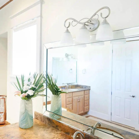 Powell Collection Transitional Three Light Vanity in Pewter Nickel Silver Finish Damp Rated for Bathrooms over mirror