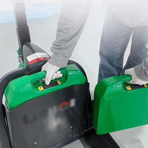 Maneuver Heavy Loads With This Smooth Full Electric Pallet Jack Truck, showcasing green lithium battery being handled.