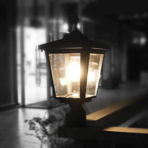 Solar Post Light Outdoor ST4319Q Cast Aluminum Filament LED on railing at night, lit with warm glow, weatherproof design