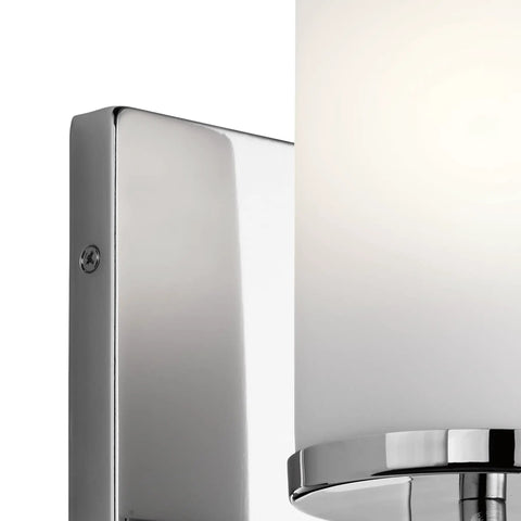 Close-up of chrome base on Crosby 9.25 Inch Chrome Wall Sconce With Satin Etched Cased Opal Glass 1 Light Modern Vanity Light