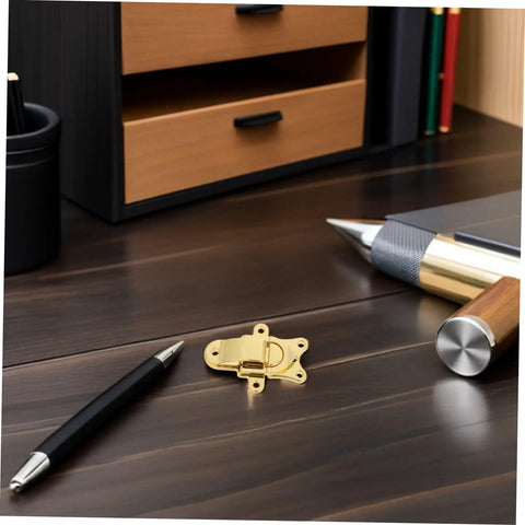 Chic 2pcs Retro Golden Duckbill Toggle Latches Fit Any Wooden Chest Or Toolbox With Stunning Zinc Alloy Finish For Vintage Decor And Secure Fastening. Gold zinc alloy latch on desk with wooden drawer and pens