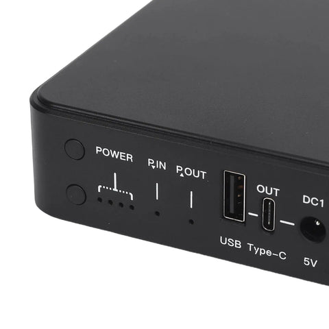 Heavy Duty Mini Ups Battery Backup Delivering Major Peace Of Mind With A Steady 10400mah Reserve And Six Amp Ports close-up view of power buttons and ports.