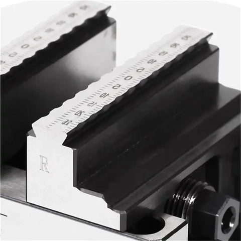 Close-up of self centering concentric vise on Rock Solid Go To Turntable Fixture with measurement markings for precise workholding.