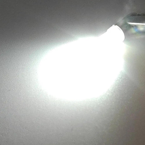 Badass E5 And E5.5 Led Bulbs 24V White Screw Base Replacement For Model Train Layouts Locos Wagons Streetlights Straight Up Heavy Duty Plug And Play 100Lm Knockout Glow Pack Of 10 bright LED bulb glowing on a surface.