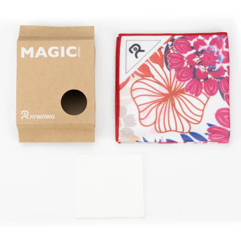 Self Adhering Lens Wrap For Cameras And Phones Protective Gear Shield Washable Cleaning And Storage Cloth For DSLR Lenses And Accessories Seventeen Point Seven By Seventeen Point Seven Inches Floral Pattern, folded cloth next to packaging