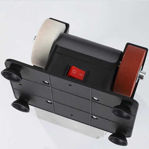 Real Badass Compact Dual Wheel Mini Bench Grinder Tabletop Sander with red power switch and dual wheels for sharpening.