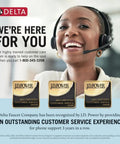 Smiling customer service representative wearing a headset beside three J.D. Power awards for Delta Faucet Company.