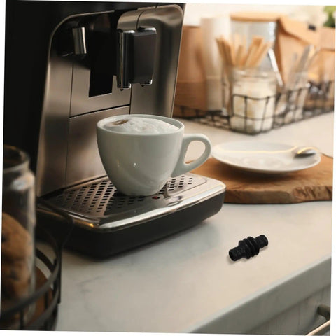 Espresso machine with cup beside Steam Wand Rubber Guard Sleeve Heat Insulation Accessory For Espresso Machines