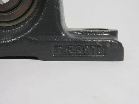 Close-up of Heavy Duty Wide Inner Ring Housed Ball Bearing Unit for Industrial Machinery with engraved code on metal housing.