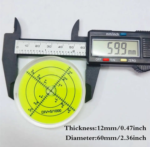 Dead On Accurate 60mm Round Bubble Spirit Level Pro Shop Premium Acrylic Craft Tool With Degree Marked Base on a caliper measuring 59.9mm.
