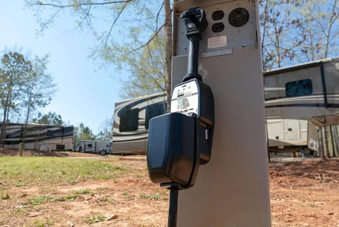 Portable 50A Surge Guard Power Protector with LED Fault Readout at RV park power outlet