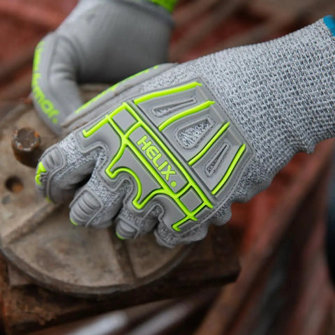 Impact Protection Safety Gloves With Polyurethane Palm Coating A4 Cut Level 13 Gauge Seamless Knit Touchscreen Compatible Helix 1074IMP in use.